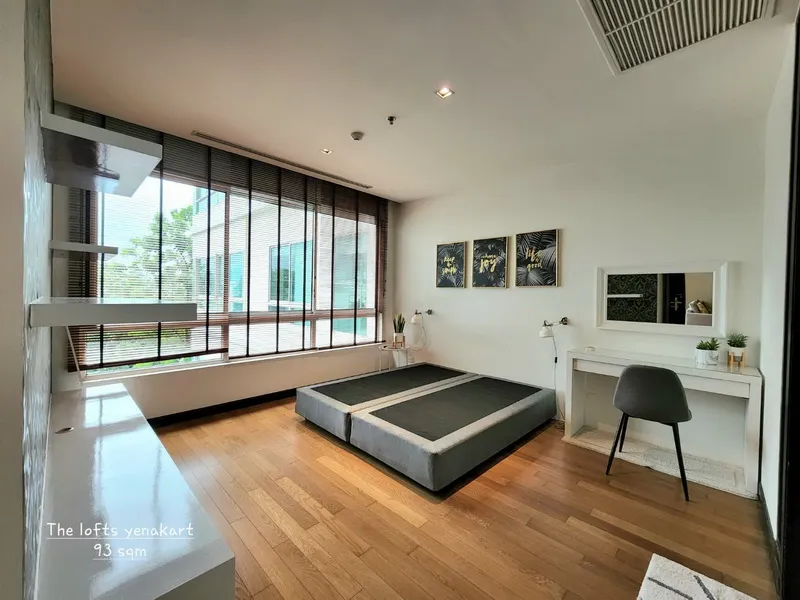 article image - Spacious room with large windows, hardwood floors, a low platform bed, framed art, and a desk with a chair. Spacious room with large windows, hardwood floors, a low platform bed, framed art, and a desk with a chair.