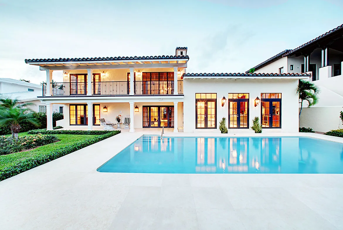 article image - A luxurious two-story villa with large windows and a swimming pool in the foreground, surrounded by lush greenery. A luxurious two-story villa with large windows and a swimming pool in the foreground, surrounded by lush greenery.