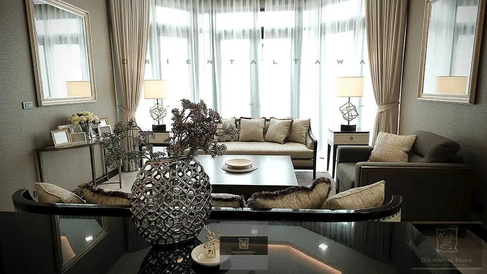 Elegant living room with modern decor, featuring a large window with sheer curtains, a comfortable sofa set, decorative vase on the coffee table, and soft ambient lighting from table lamps.