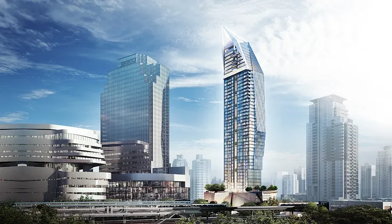 Skyscrapers in a modern city skyline under a blue sky with scattered clouds.