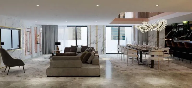 Modern open-plan living and dining area with neutral tones, marble accents, large sectional sofa, elegant chandelier, and ample natural light.