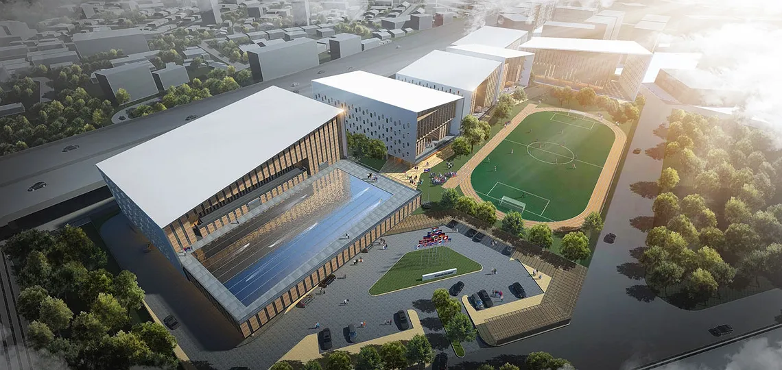 ภาพถ่ายทางอากาศของกลุ่มอาคารสถาปัตยกรรมสมัยใหม่ ประกอบด้วยอาคารทรงสี่เหลี่ยมผืนผ้า ส