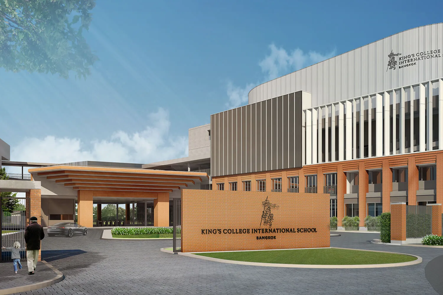 อาคารเรียนสมัยใหม่ที่มีผนังอิฐสีส้ม หน้าต่างสูง และป้ายเขียนว่า "โรงเรียนนานาชาติคิง