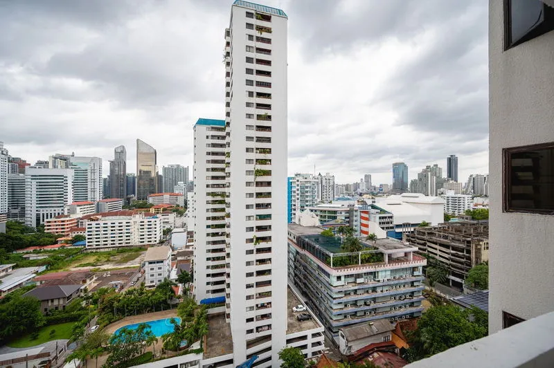 article image - Cityscape view of tall residential and commercial buildings under a cloudy sky. Cityscape view of tall residential and commercial buildings under a cloudy sky.