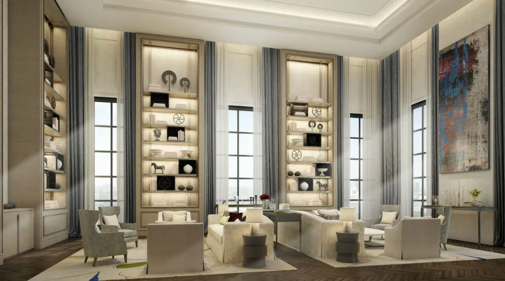 Luxurious living room with high ceilings, plush seating, tall bookshelves, modern decor, and large windows.