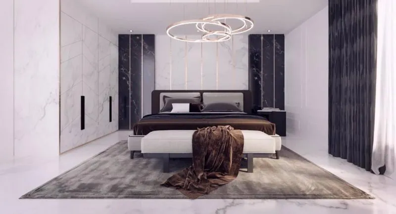 ห้องนอนสไตล์มินิมอลทันสมัย ​​ตกแต่งด้วยหินอ่อน เตียงนอนนุ่มสบาย โทนสีขาวดำ และโคมไฟระย