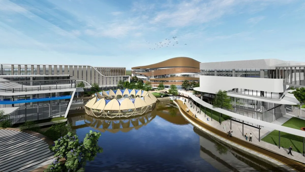 กลุ่มอาคารสถาปัตยกรรมสมัยใหม่ที่มีอาคารโค้งมน โครงสร้างทรงกลมเหนือน้ำ และทางเดินที่ต