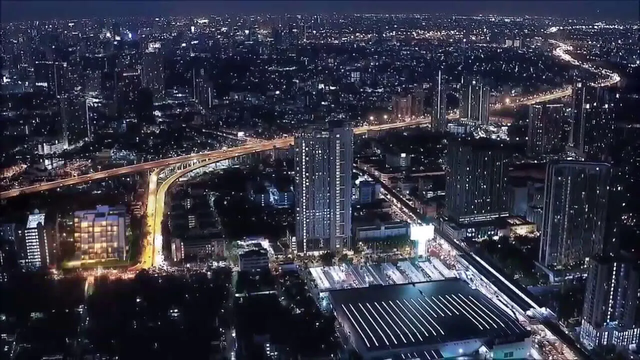 article image - Aerial nighttime view of a cityscape with illuminated buildings and busy roads stretching into the distance. Aerial nighttime view of a cityscape with illuminated buildings and busy roads stretching into the distance.