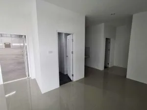 Minimalist interior with white walls, two open doorways revealing a hallway and another space, glossy gray floors, and a partially visible open door leading outside.
