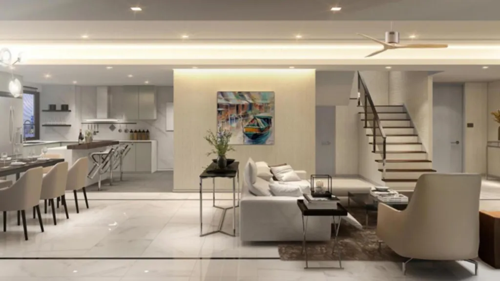 Modern open-plan living space with kitchen, dining table, sofa, stairs, ceiling fan, and artwork on the wall.