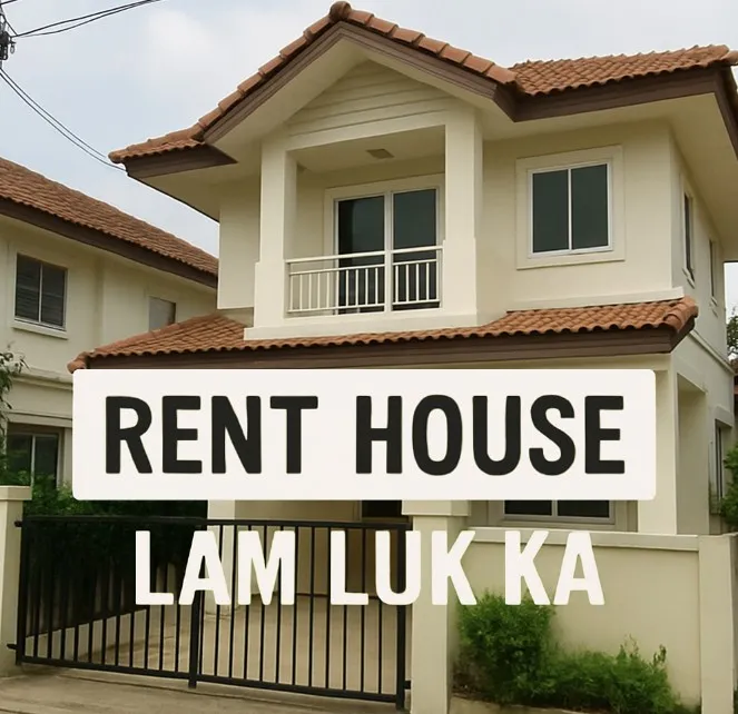 Two-story house with a red tile roof and white exterior, featuring a gated driveway. Text reads 