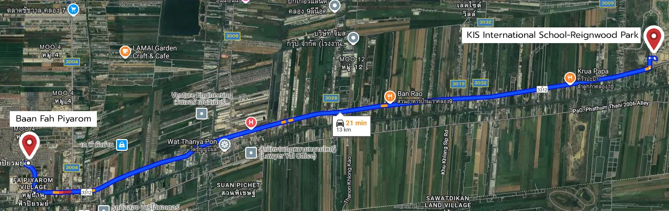 Map showing a 13 km route from Baan Fah Piyarom to KIS International School-Reignwood Park, taking 21 minutes by car, with landmarks and roads labeled.