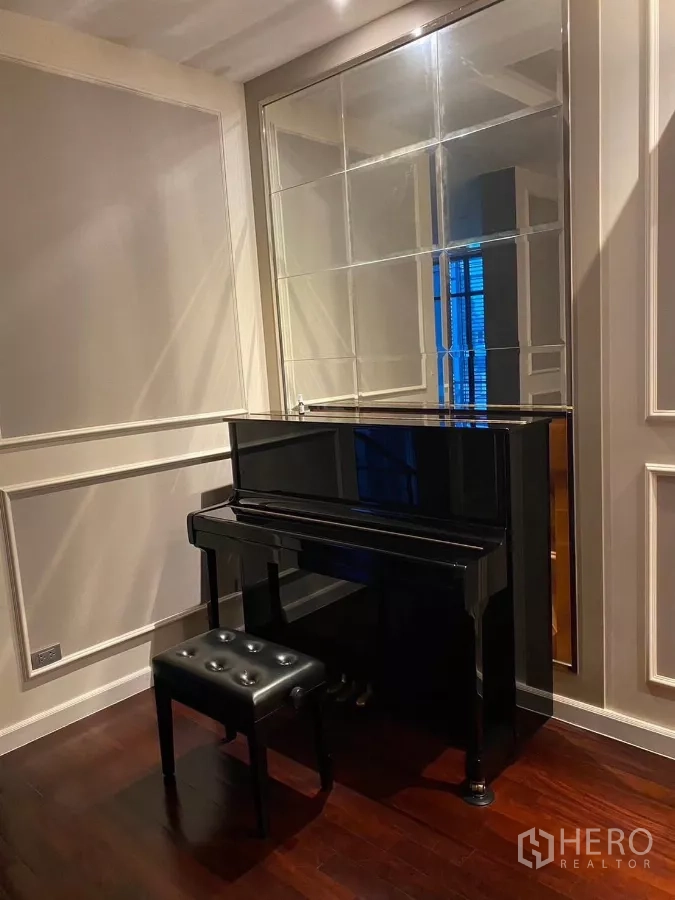 Detached House for rent in Bang Bon, Bangkok - Music corner featuring an upright piano and wall mirror on wooden flooring.