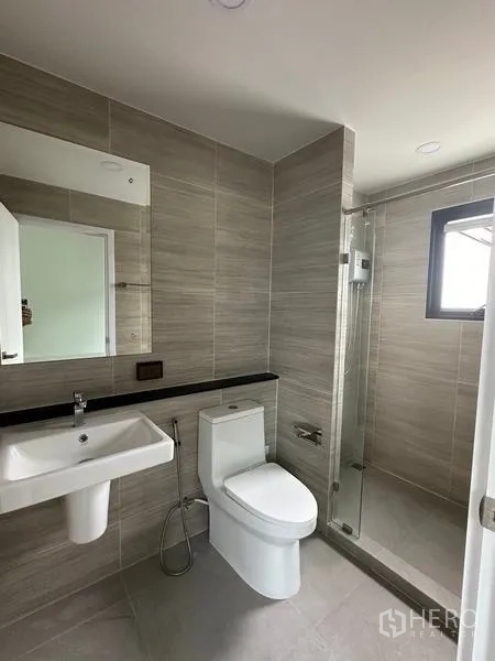 Detached House for sale in Khlong Sam Wa, Bangkok - Contemporary tiled bathroom with glass shower enclosure and window