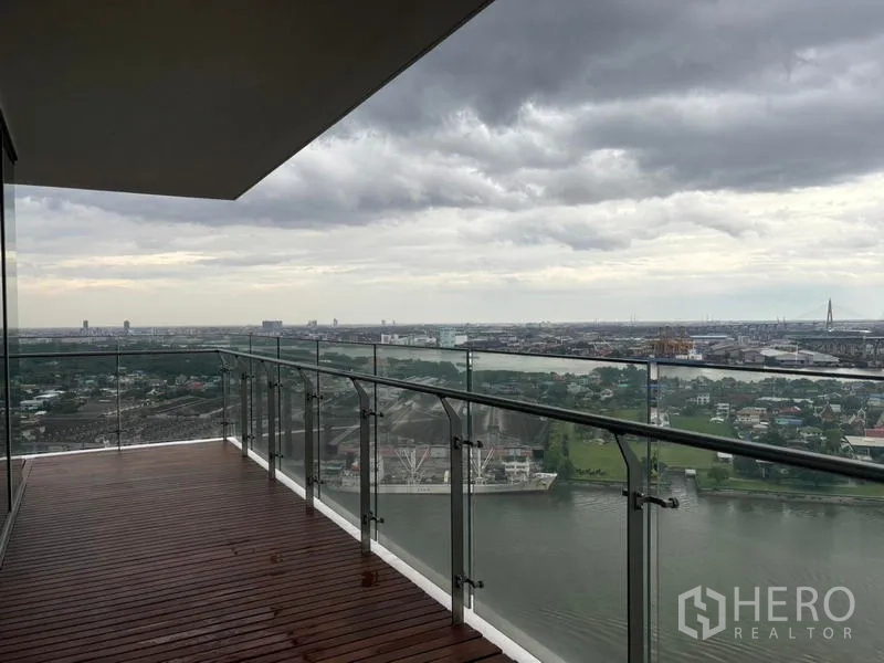 Condominium for rent - Balcony with river outlook and clear glass balustrade.