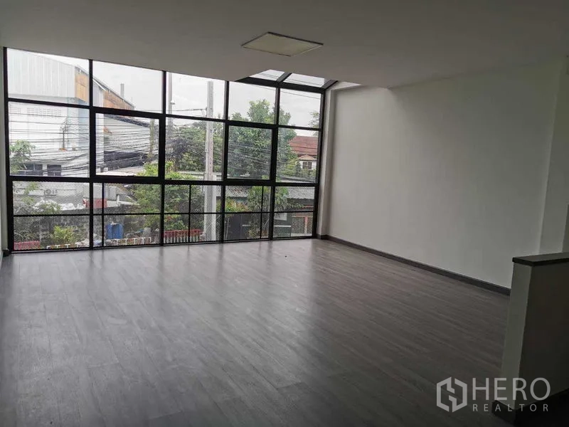 Home Office for rent or sale - Bright upper floor workspace with floor-to-ceiling corner windows.