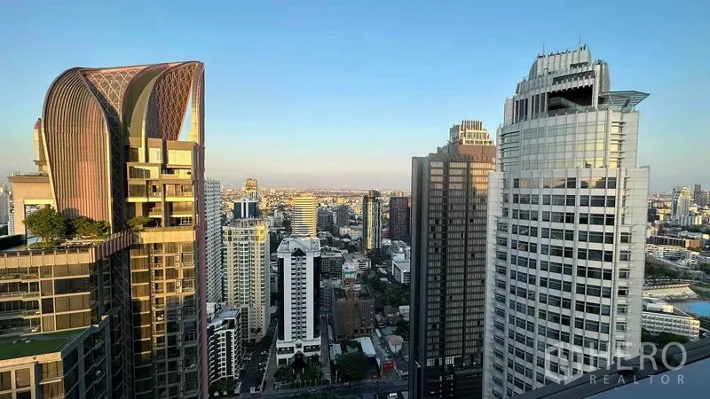 Condominium for sale - Wide panoramic view of Bangkok skyline from the building’s upper floors.