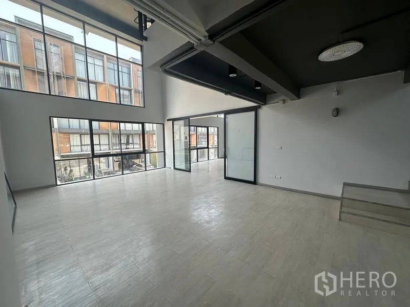 Home Office for rent - Bright corner area with expansive glazing overlooking neighboring buildings.