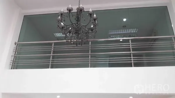 Office Space for rent in Bueng Kum, Bangkok - Double-height reception with chandelier and glass mezzanine railing.