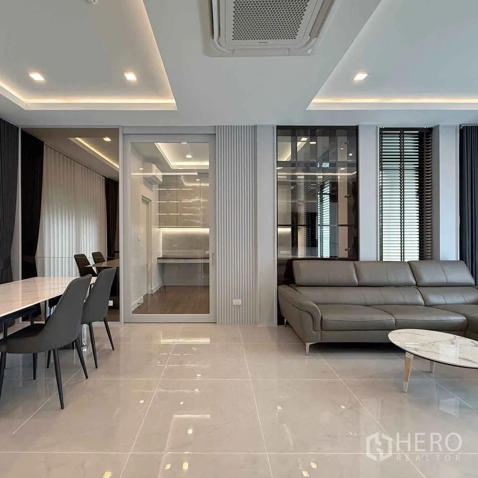 Detached House for rent in Bang Phli, Samut Prakan - Open-plan living and dining with glass partition and large windows.