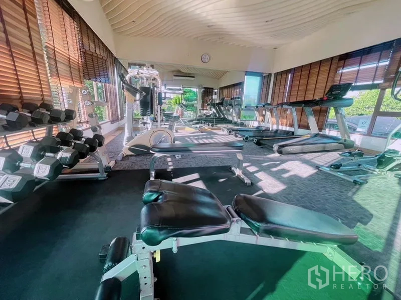 Detached House for rent in Prawet, Bangkok - Residents’ fitness room with treadmills, free weights, and strength machines.