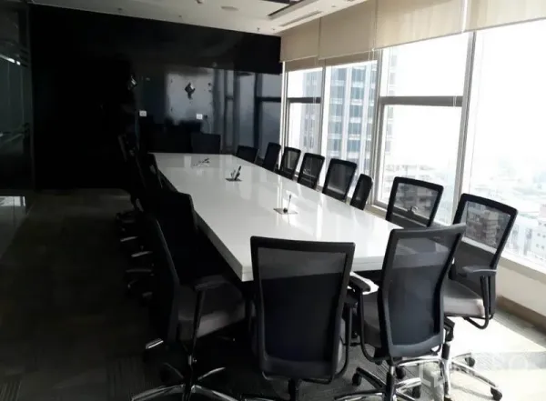 Office Space for rent in Bang Rak, Bangkok - Large boardroom with a long white conference table and city-view windows in Bang Rak.