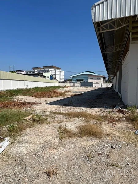 Warehouse for rent or sale - Outdoor loading and yard space beside the warehouse with boundary wall.