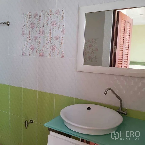 Home Office for rent in Watthana, Bangkok - Guest bathroom with round vessel sink, mirror and green accent tiles.