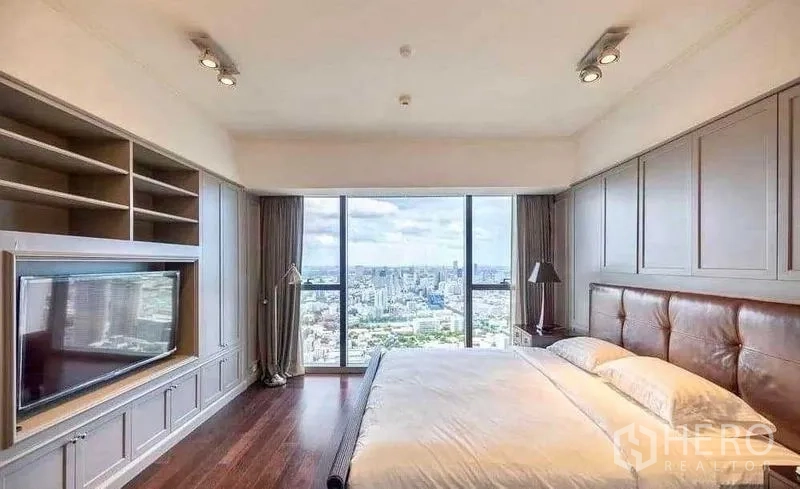 Condominium for rent - King bedroom with built-in TV cabinetry and skyline view.