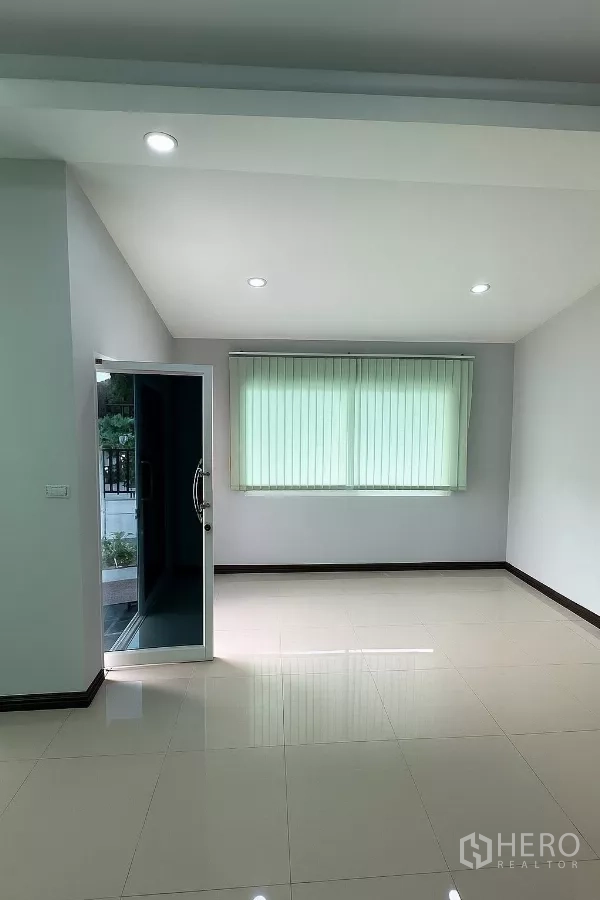 Home Office for rent in Bang Phli, Samut Prakan - Spacious office area with large window, recessed lighting and doorway to the front terrace.