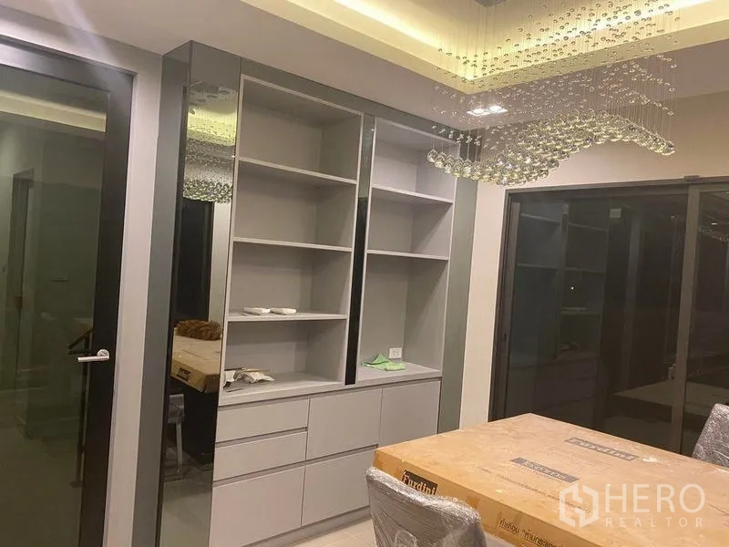 Detached House for rent - Built-in storage cabinets beside sliding doors under a crystal chandelier.
