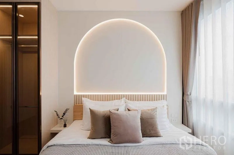 Condominium for rent in Watthana, Bangkok - Master bedroom with arch-lit headboard, soft bedding, and wardrobe by the window.