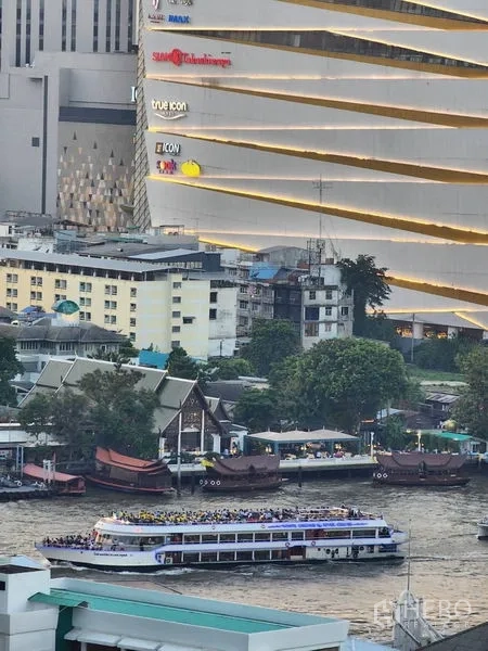 Condominium for rent in Bang Rak, Bangkok - Close-up of the riverside with passenger boat cruising past the ICONSIAM shopping complex.