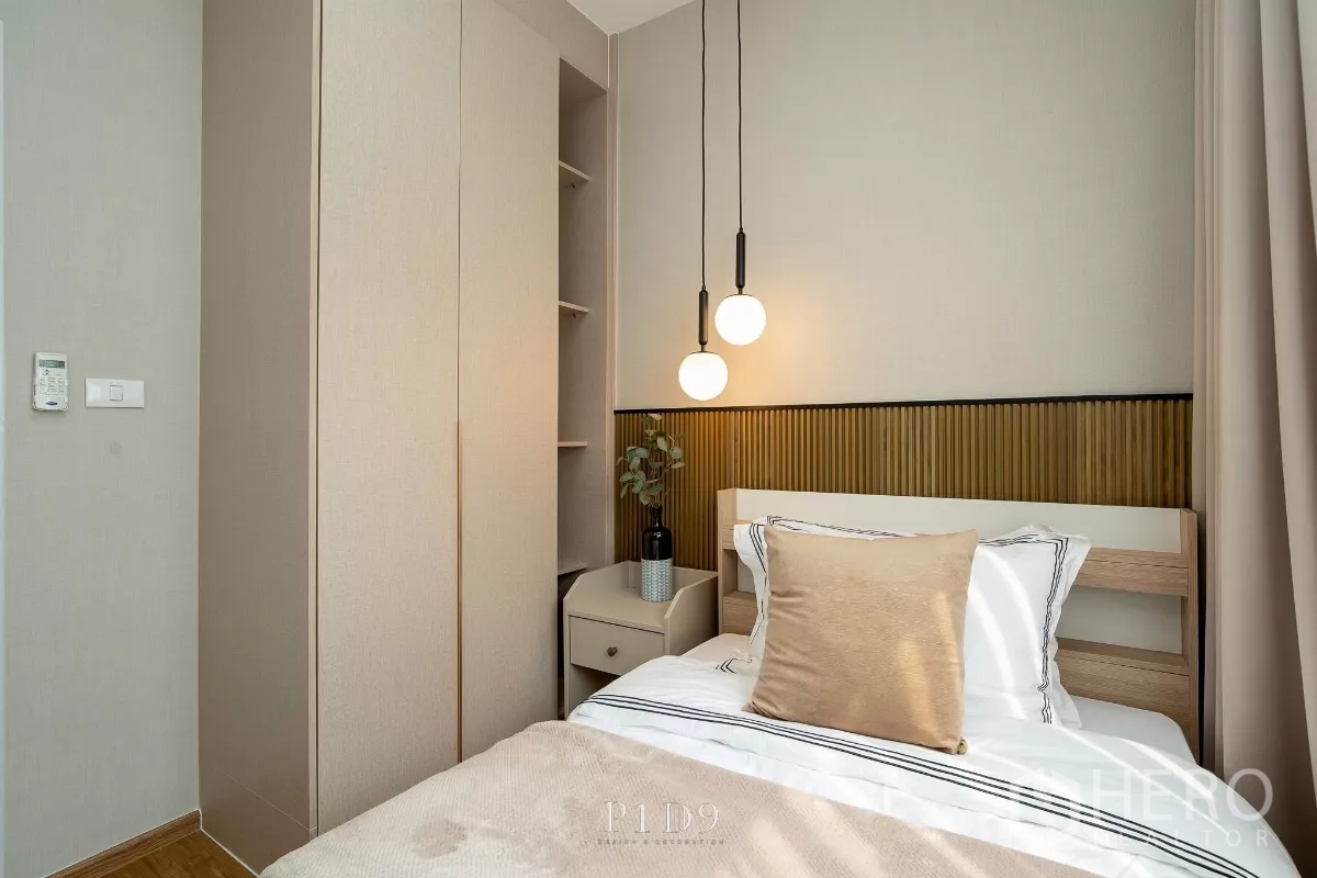 Townhouse for rent in Bang Phli, Samut Prakan - Guest bedroom angle showing wardrobe, bedside table and soft tones