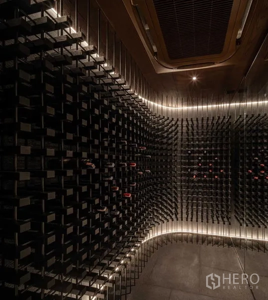 Detached House for sale in Saphan Sung, Bangkok - Climate-controlled wine cellar with wall-mounted racks and ambient lighting.