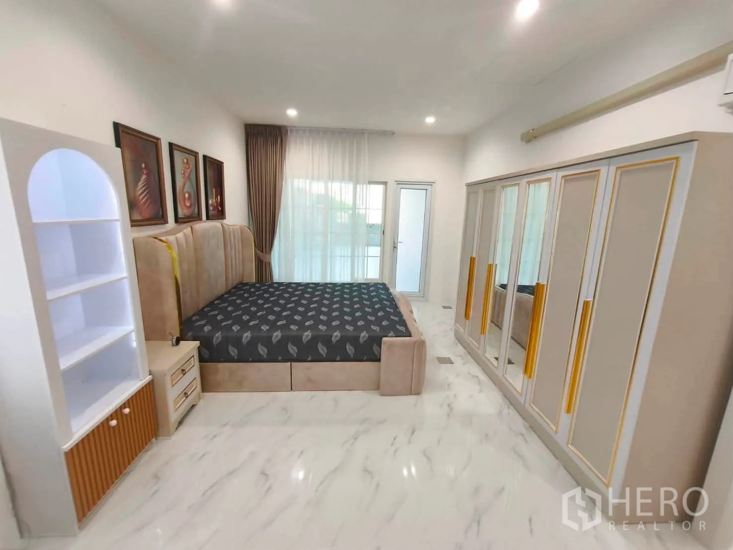 Detached House for rent in Bang Phli, Samut Prakan - Large master bedroom with tall wardrobes and a sliding glass door.