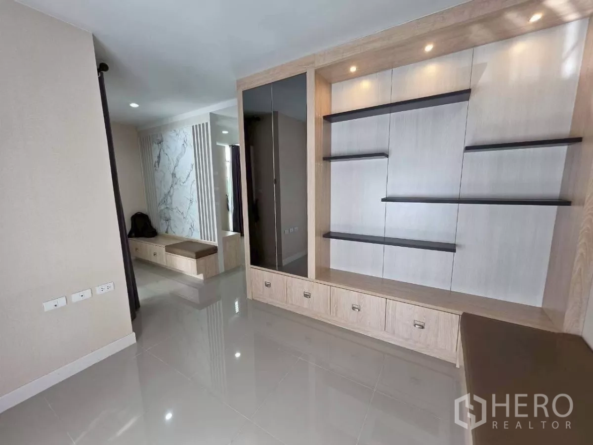 Detached House for rent or sale in Samut Prakan - Built-in media wall and bench storage featured in the main living room.