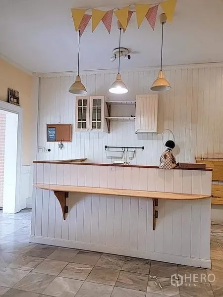 Detached House for rent - Breakfast bar with pendant lights and white shiplap wall.