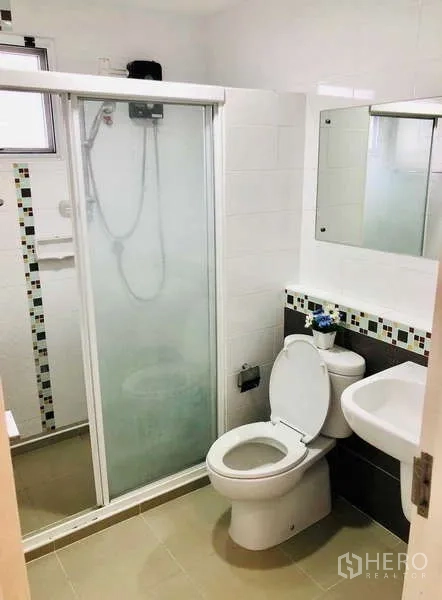 Detached House for rent or sale - Bathroom with glass shower enclosure, sink and toilet.