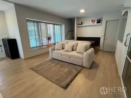 Semi-detached House for rent in Prawet, Bangkok - Living area with bay window seating and abundant natural light.