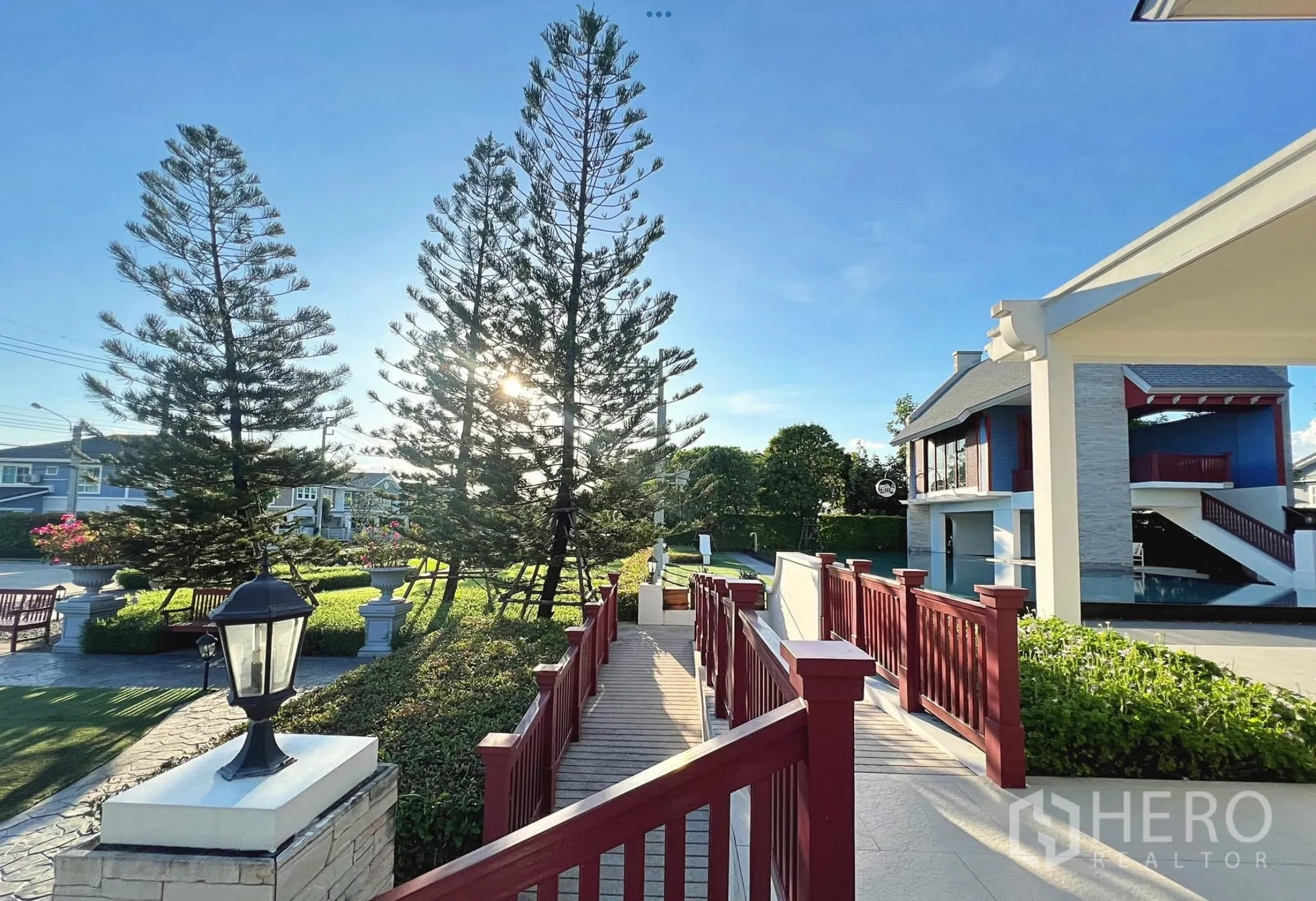 Townhouse for rent or sale in Sai Mai, Bangkok - Community clubhouse area with bridge, lawns and landscaped gardens.