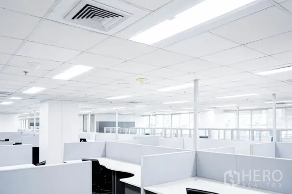 Office Space for rent in Watthana, Bangkok - Bright open-plan office with ceiling grid, LED lights and rows of cubicles.