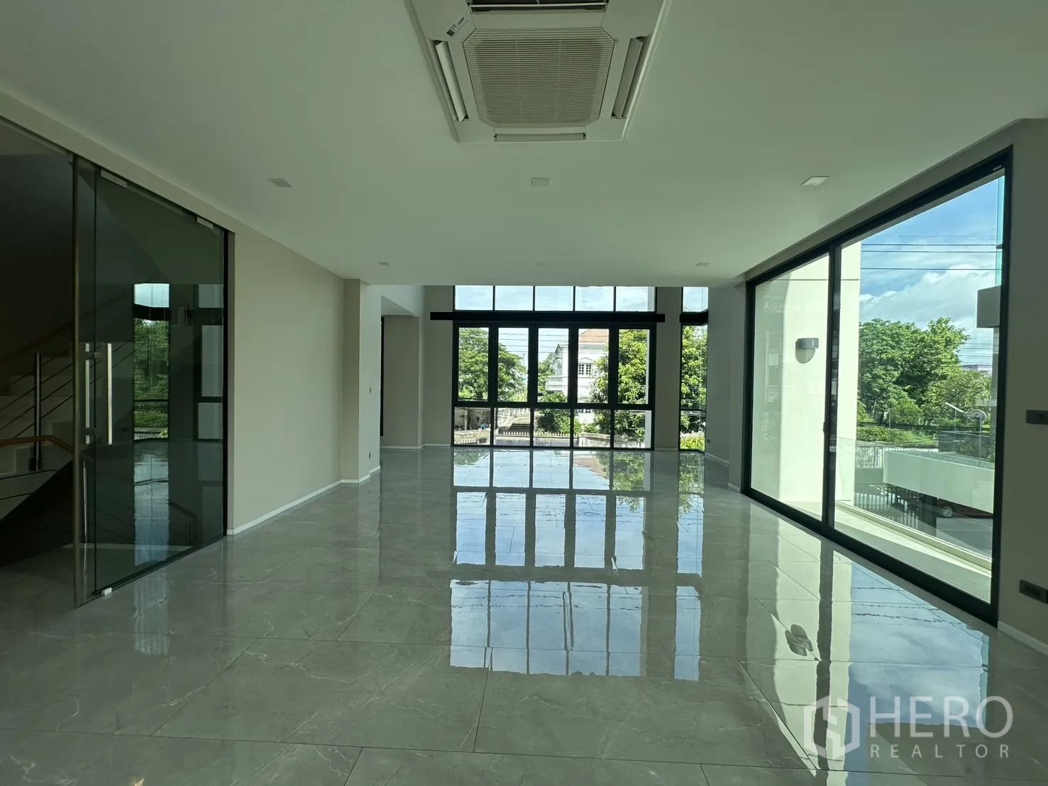 Home Office for rent or sale in Suan Luang, Bangkok - Open floor with glass meeting room, staircase, and cassette AC.