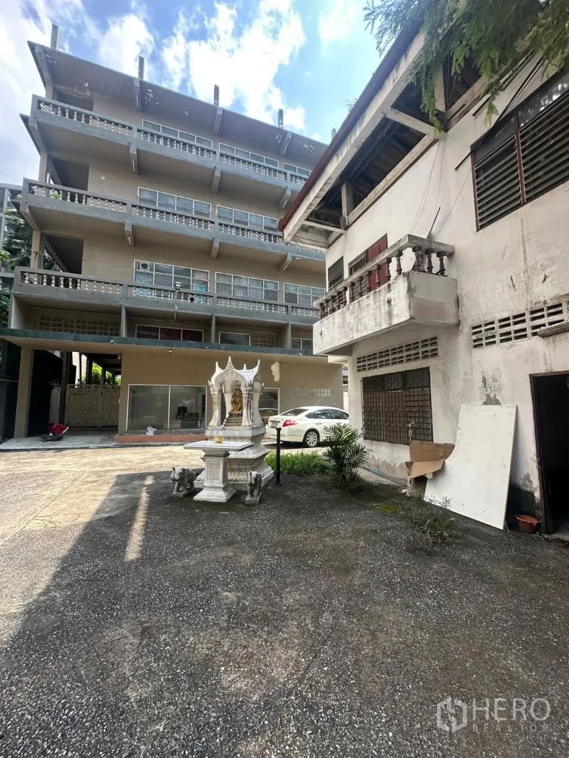 Office Space for rent - Courtyard view of main office and annex with spirit house