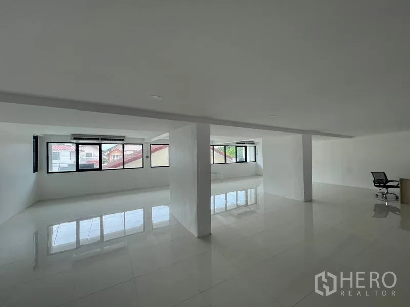 Office Space for rent or sale in Wang Thonglang, Bangkok - Open office area with long rows of windows on two sides for natural light.