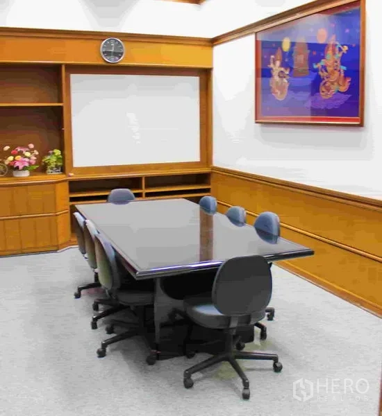 Office Space for rent in Lak Si, Bangkok - Executive meeting room with a long conference table, swivel chairs and built-in cabinetry.