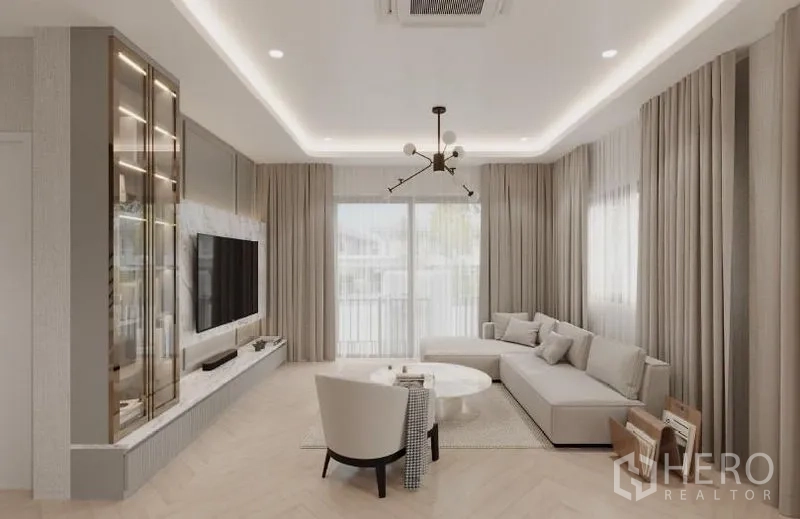 Detached House for rent in Bang Phli, Samut Prakan - Spacious lounge with L-shaped sofa, sliding glass doors and contemporary ceiling lights.