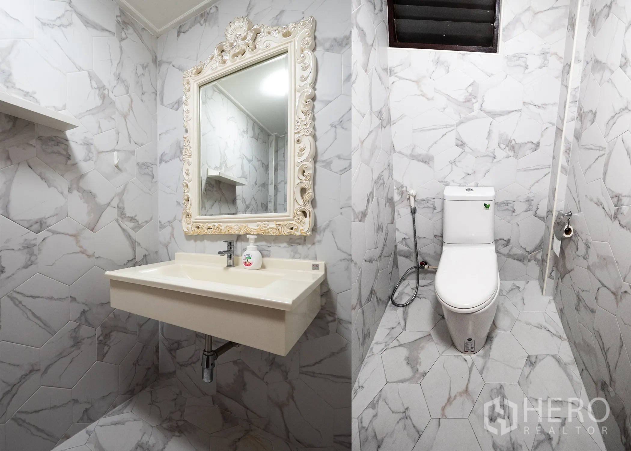 Townhouse for rent in Khlong Toei, Bangkok - Bathroom with marble-look hex tiles and an ornate framed mirror.