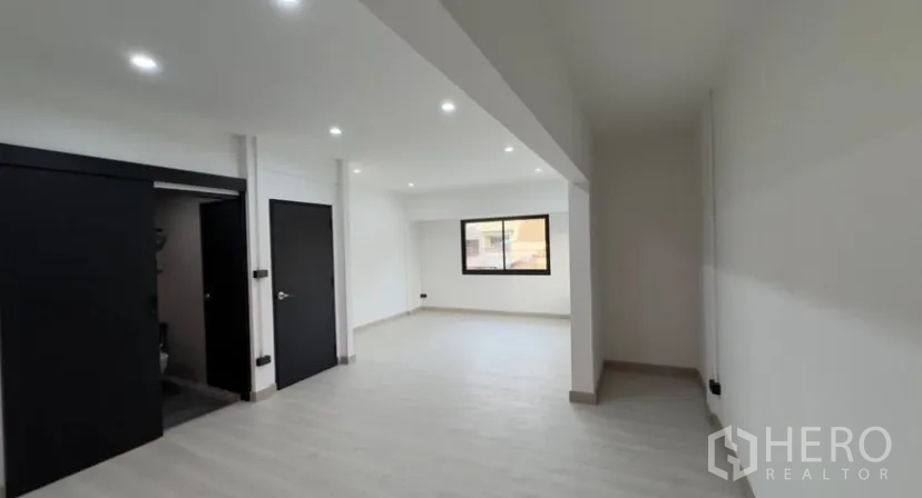 Detached House for rent in Suan Luang, Bangkok - Bedroom with doorway to an en-suite bathroom, white walls and a window.