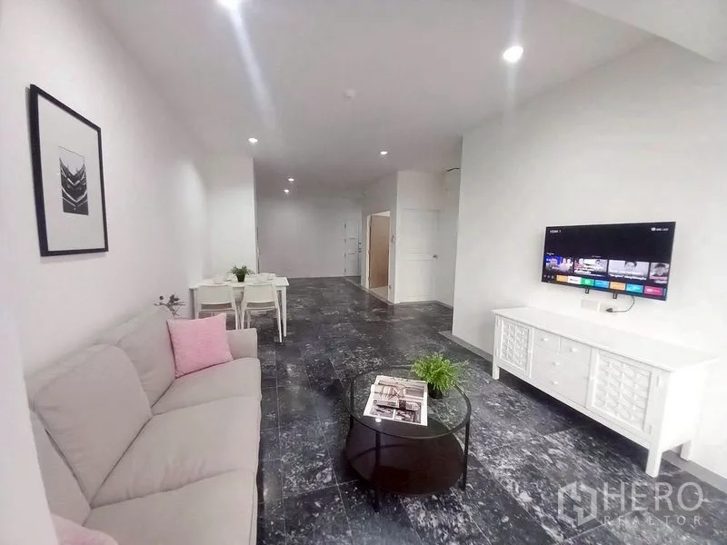 Condominium for rent in Watthana, Bangkok - Wide open-plan interior with kitchenette and access to bathroom and bedroom.